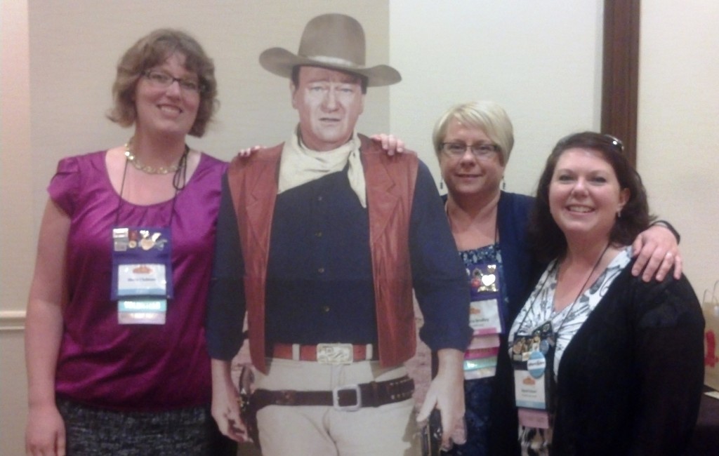 Shelly Chalmers, Marni Folsom, and I pose with John Wayne.